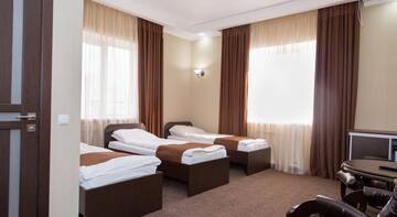 Фото номера Трехместный номер с ванной Гостиница Elion Hotel г. Балаково 3